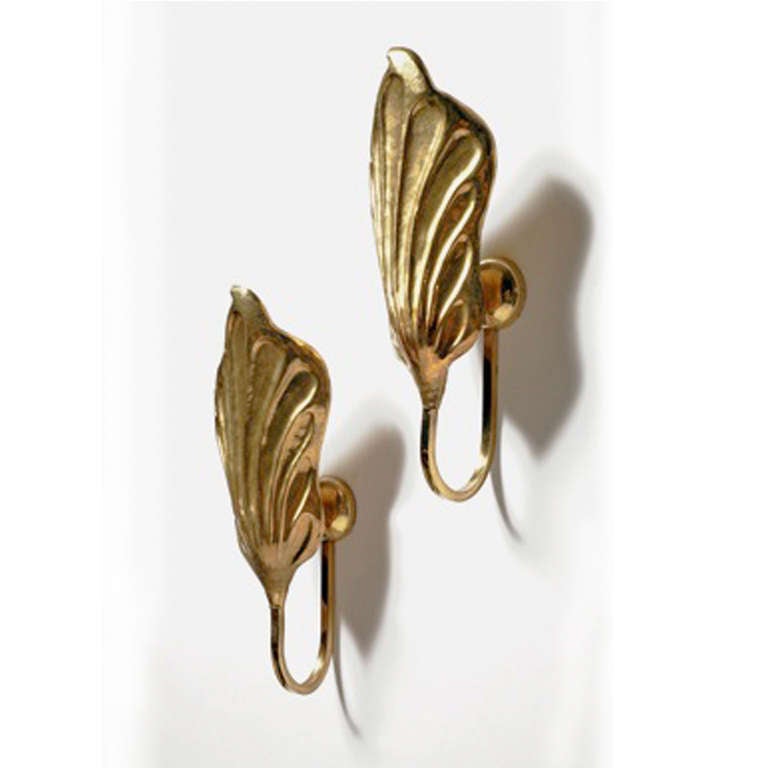 Sconces designed by Tommaso Barbi hand-made in golden brass in vegetable form. Italy 1970´s. Measures: 18x 15x 37 cm