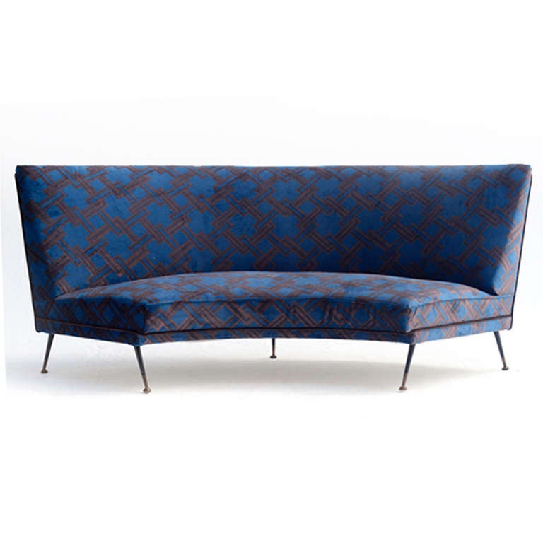 Three seat semicircular sofa upholstered in cotton velvet edited by Gaston y Daniela, ledged in black lacquer metal finished in pivoted feet. Italy 1950’s
