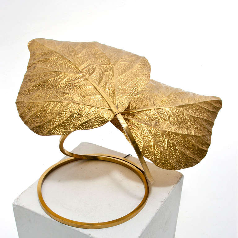 Table lamp designed by Tomasso Barbi handmade in golden brass in vegetable form with two leafs. Italy 1970.