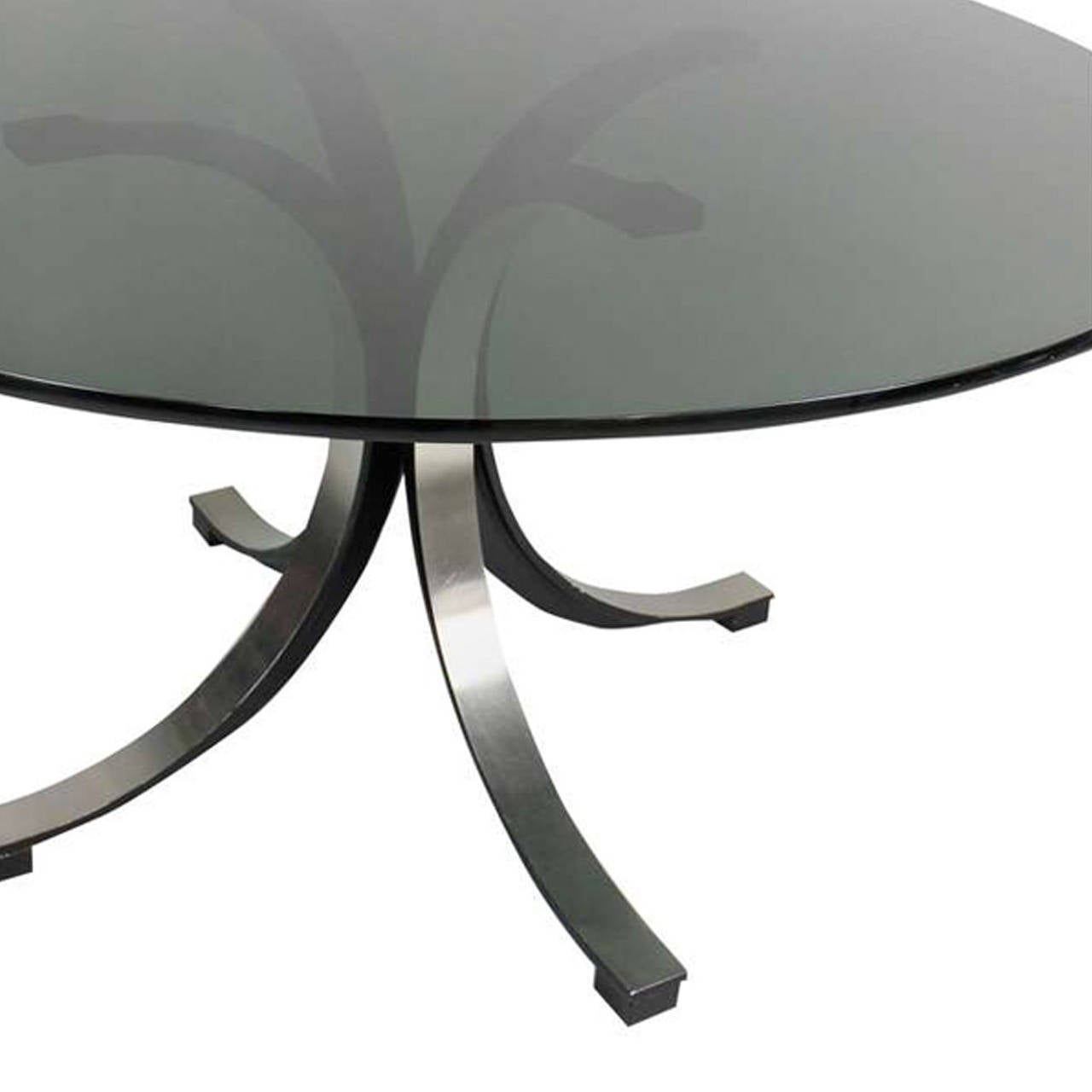 Pedestal table designed by Osvaldo Borsani and Eugenio Berli edited by Tecno, made in black lacquer metal finished in steel gusset with smoked black crystal on top.