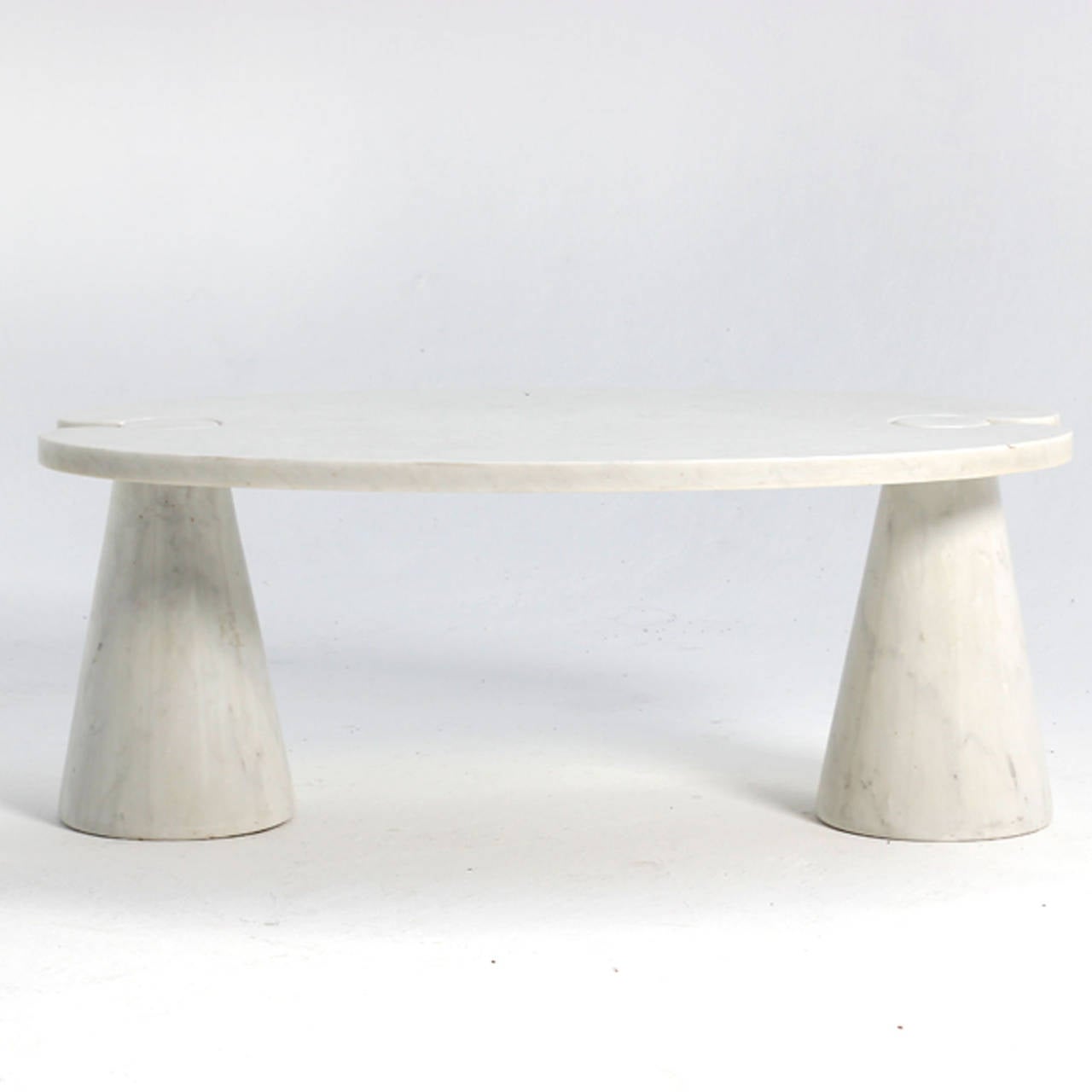 Center table designed by Angelo Mangiarotti composed by two legs in conical form and top made in carrara white marble.
