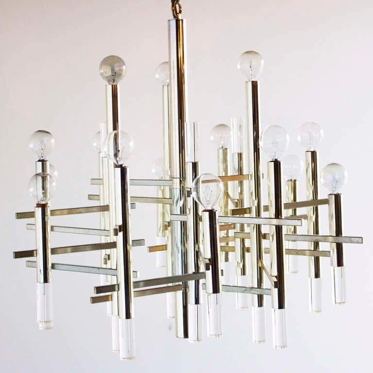 Sciolari Lucite and chrome chandelier.

The chandelier is in excellent vintage condition. There is slight oxidation (pictured). The chandelier speaks for itself, it's amazing.

Chain to ceiling: 13.5 in. 

Please ask all questions prior to