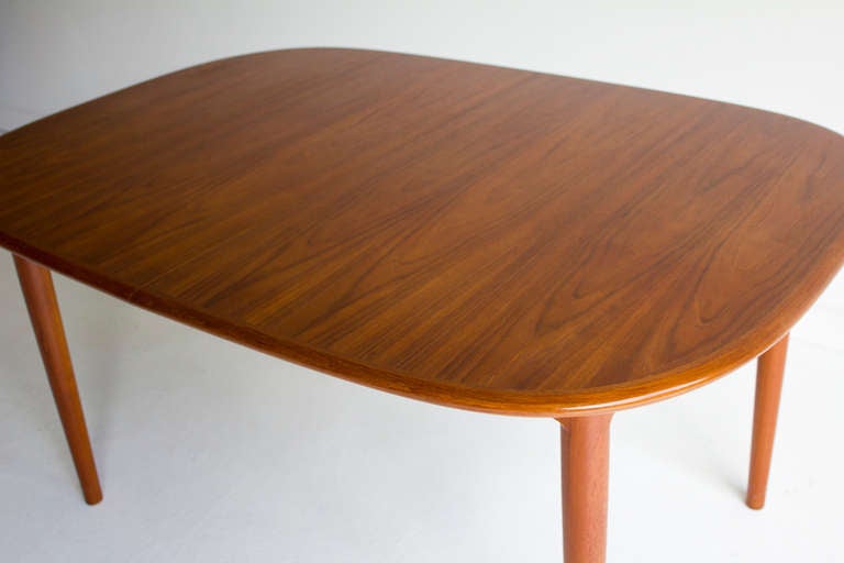 Danish modern teak dining table.

The table is in very good vintage condition. Slight scratching to surface consistent with age (pictured).

Dimensions: Height: 28.75 in. (73cm).
Width: 41.25 in. (104.8cm).
Length: 58 in. (147.3cm).
Leaf