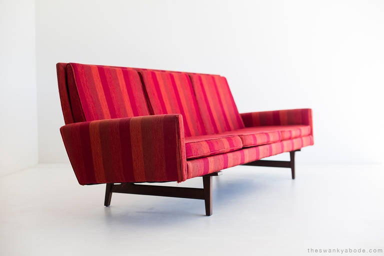 Designer: Jens Risom.

Manufacturer: Jens Risom Design Inc.
Period/Model: Mid-Century Modern.
Specifications: Walnut, fabric.

Condition:

The sofa is in good vintage condition and structurally sound. The sofa should be reupholstered as