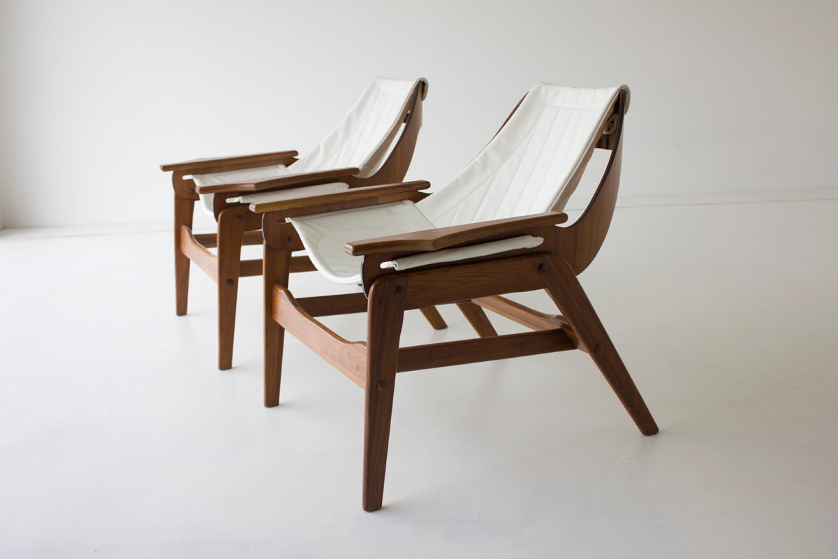 Designer: Jerry Johnson.

Manufacturer: Unknown.
Period/Model: Mid-Century Modern.
Specs: Walnut, leather.

Condition:

These Jerry Johnson sling lounge chairs are in excellent restored condition. The bases have been refinished (with normal