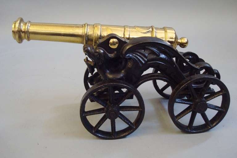 British 19th Century Pair of Ornamental Brass Cannons on Cast Iron 4 Wheel Carriages