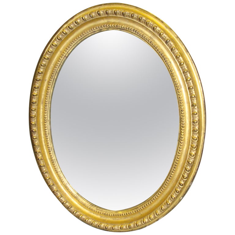 Early 19th Century Giltwood Oval Wall Mirror For Sale at 1stDibs