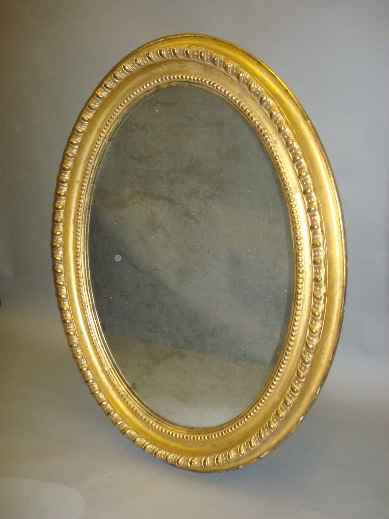 Early 19th Century Giltwood Oval Wall Mirror For Sale 1