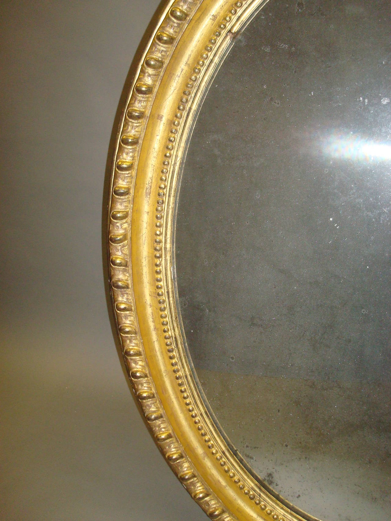 Early 19th Century Giltwood Oval Wall Mirror For Sale 4