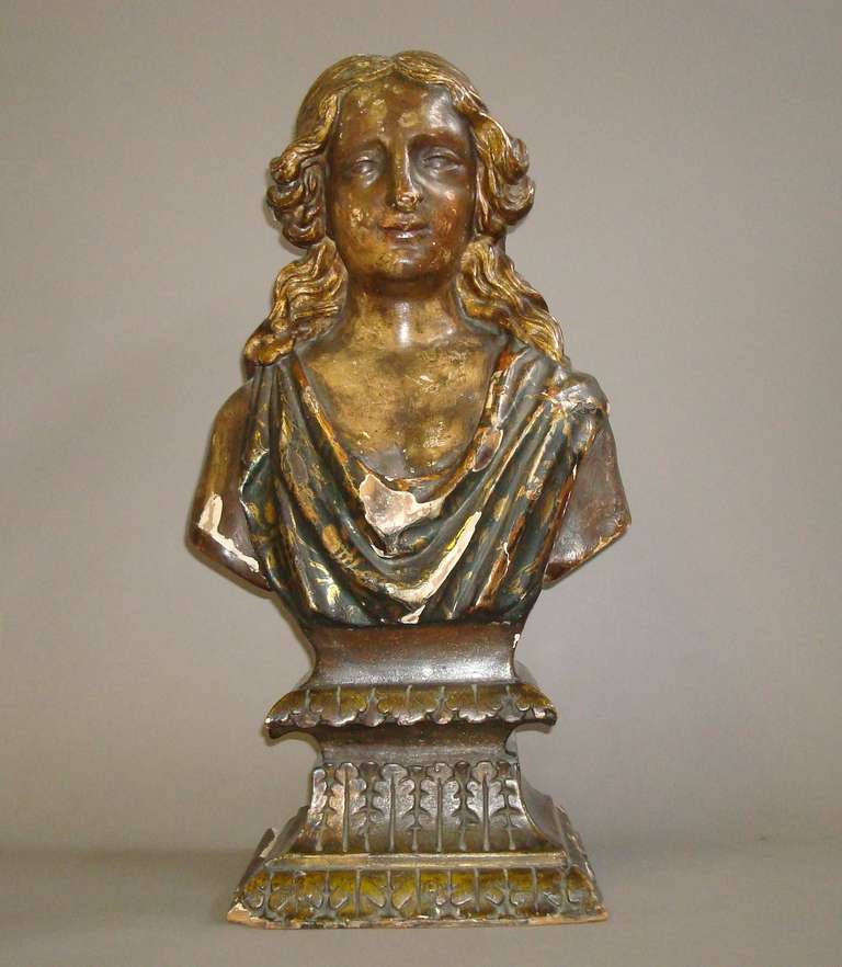An Interesting Late C17th Italian Carved Giltwood and Polychrome Bust