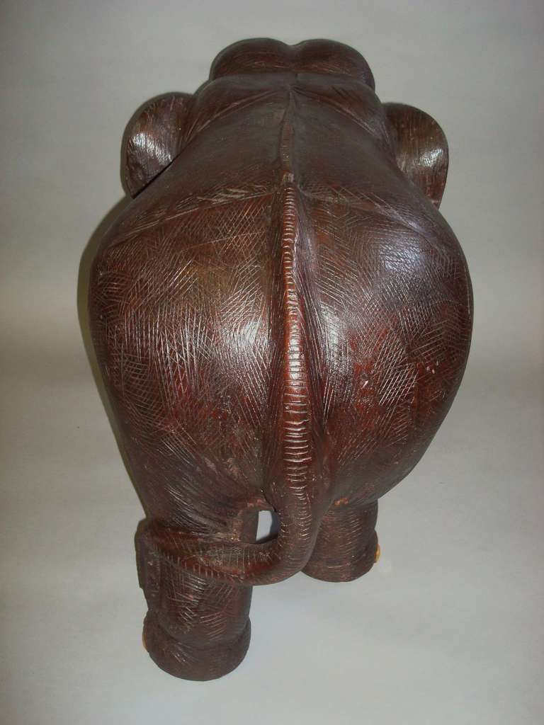 wood carved elephants with ivory tusks