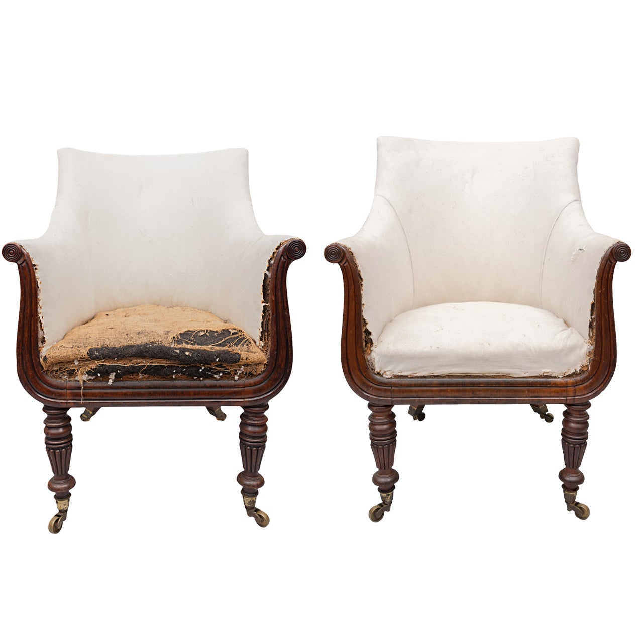A Pair of Regency Mahogany Bergere Library Chairs