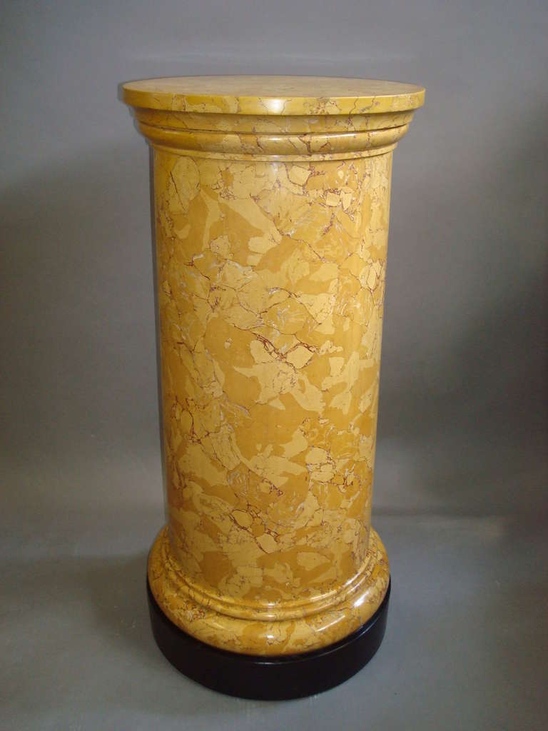 An early C19th neo classical scagiola pedestal column of cylindrical form in faux sienna marble raised on a black plinth base.

Height 34 ins; Diameter 16 ins base; 15ins top