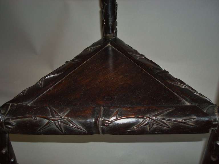 A C19th Chinese Carved and Ebonised 'Hongmu' Stand 1