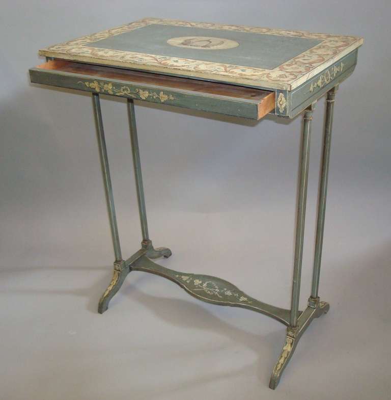 A fine Regency painted occasional or end table, the rectangular top painted with a central crest, bearing the latin inscription 