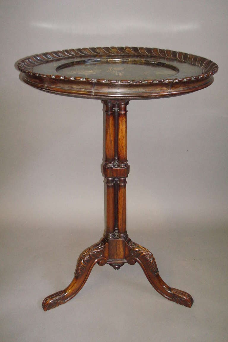 A good Gillows Regency rosewood and papier mache tripod occasional table, the circular papier mache top having a dished centre with Chinoiserie decoration on a black lacquered background, set within a gadrooned rosewood border.  The central pedestal