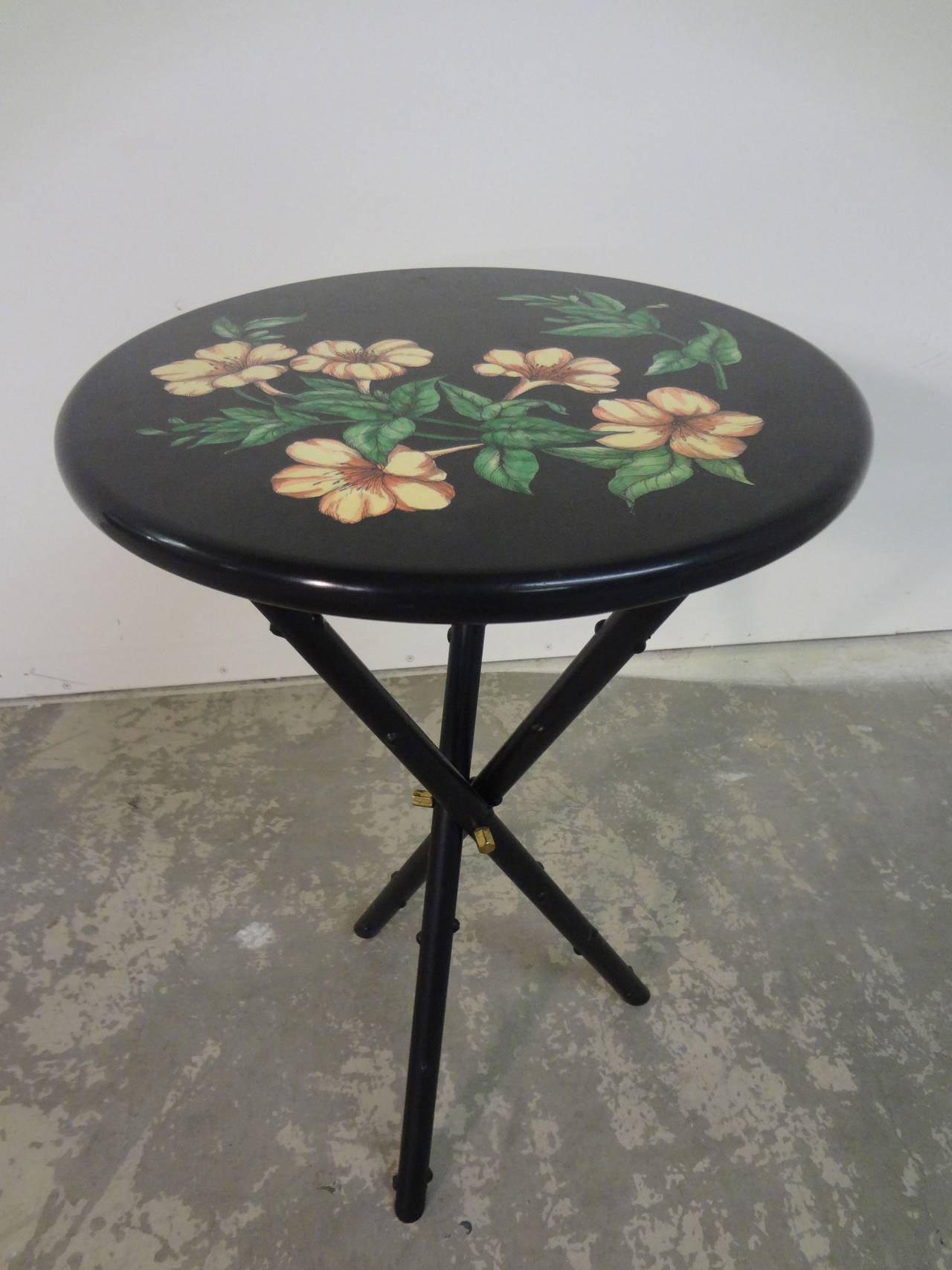 Occasional table by Piero Fornasetti, circa 1960s with original brass hardware and label present.