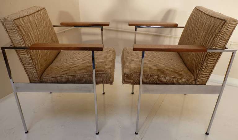 Pair of Paddle Arm Chairs by George Nelson for Herman Miller in stunning original fabric. Original Herman Miller circle tag present to underside as shown.