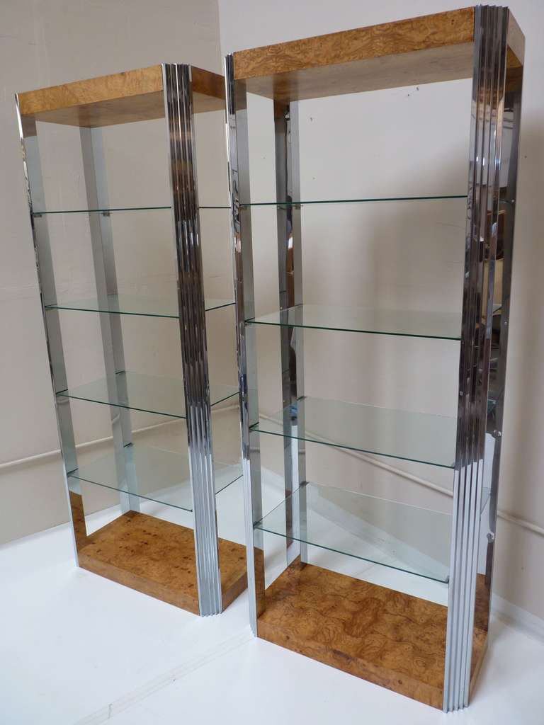 Pair of Display Book Cases by Milo Baughman in Burlwood and Chrome in original condition. Burl bases and canopies display beautiful and figurative book-matched grain as shown in pics. These units show their age with minor imperfections to the