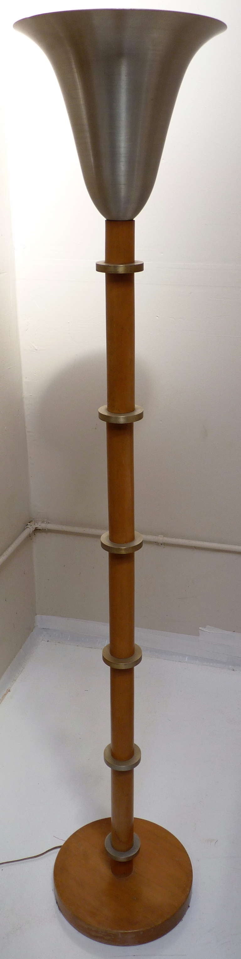 Russel Wright Aluminum Floor Lamp with solid wood and brass rings to stem and spun aluminum upper. Torchiere is in excellent condition with nice patina to wood and brass and aluminum free of typical dings. Ready for installation, this early