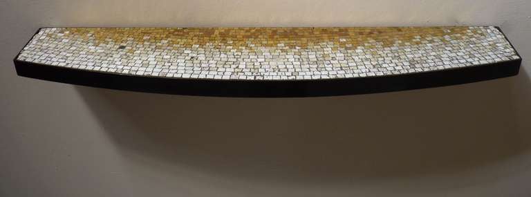 Glass tile wall-mounted console or shelf by Vladimir Kagan. Vibrant mosaic with patinated bronze band. Custom made for a house in Miami, Florida. This is the only piece from the collection yet to be offered until now.