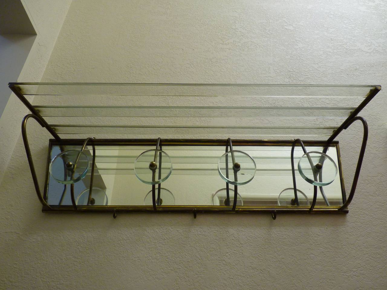 Italian coat rack valet in brass and glass from Carlo Mollino's Lutrario Dance Hall in Turino, Italy. 
Provenance on request.