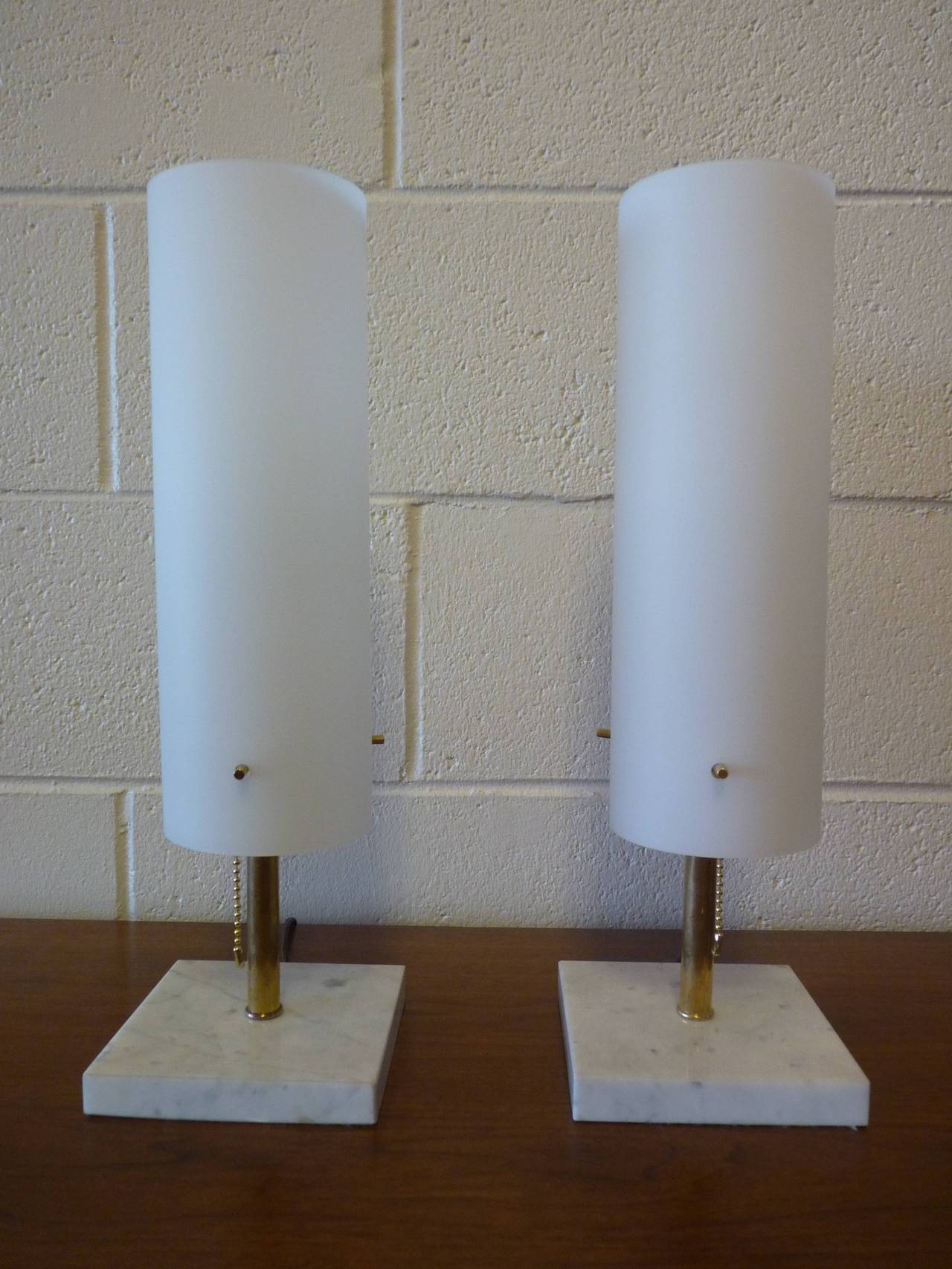 Pair of Murano lamps of brass and marble. Carrara marble base with polished brass stem and hardware float glass shade. Recently rewired and ready for installation. Diameter of glass shade measures 4