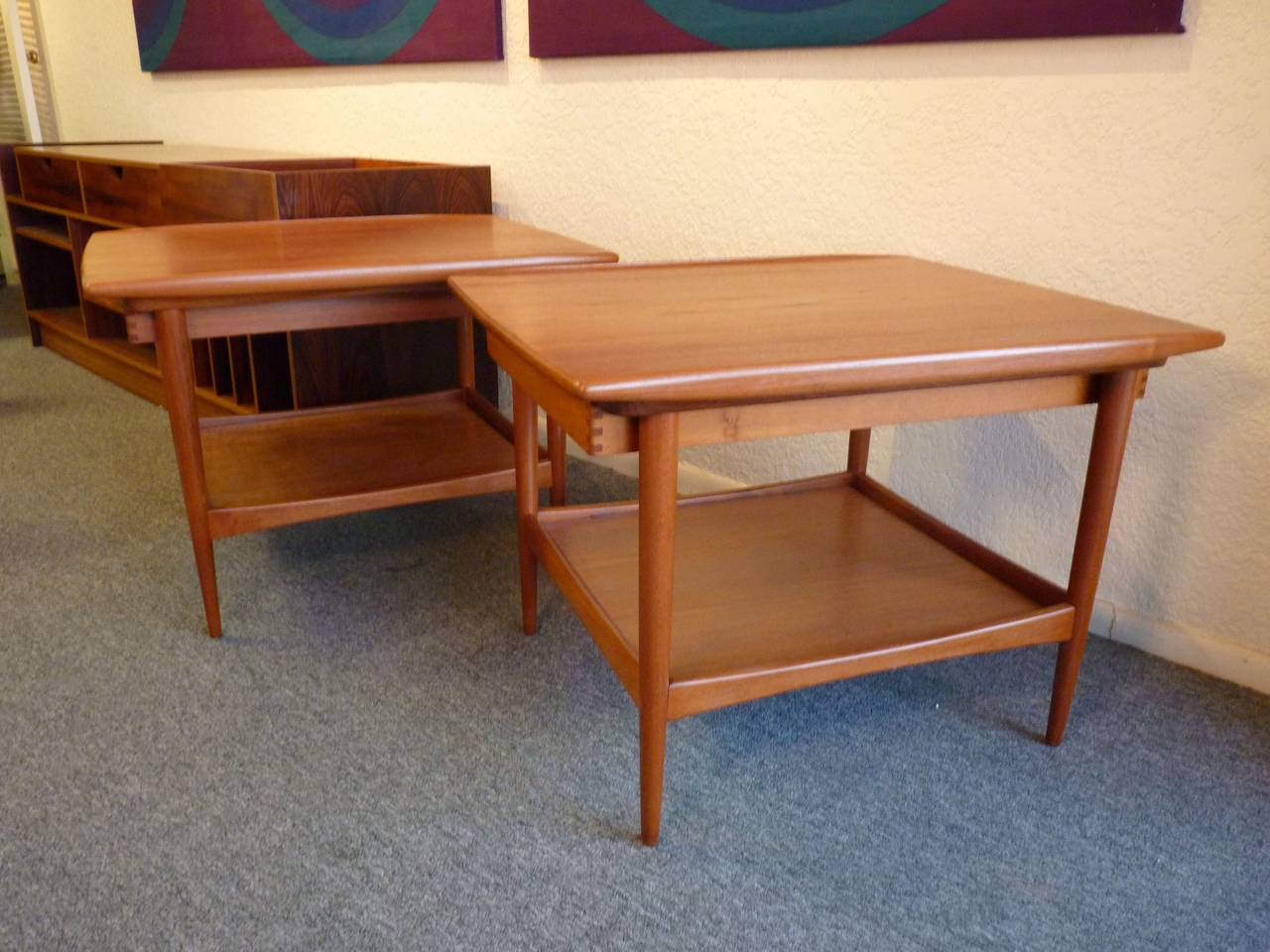 Pair of Danish modern side tables by Moreddi with drawers that slide toward front or rear. Excellent quality craftsmanship displayed in sculpted edge and dovetail drawer. Pair is in excellent condition with lacquer finish.