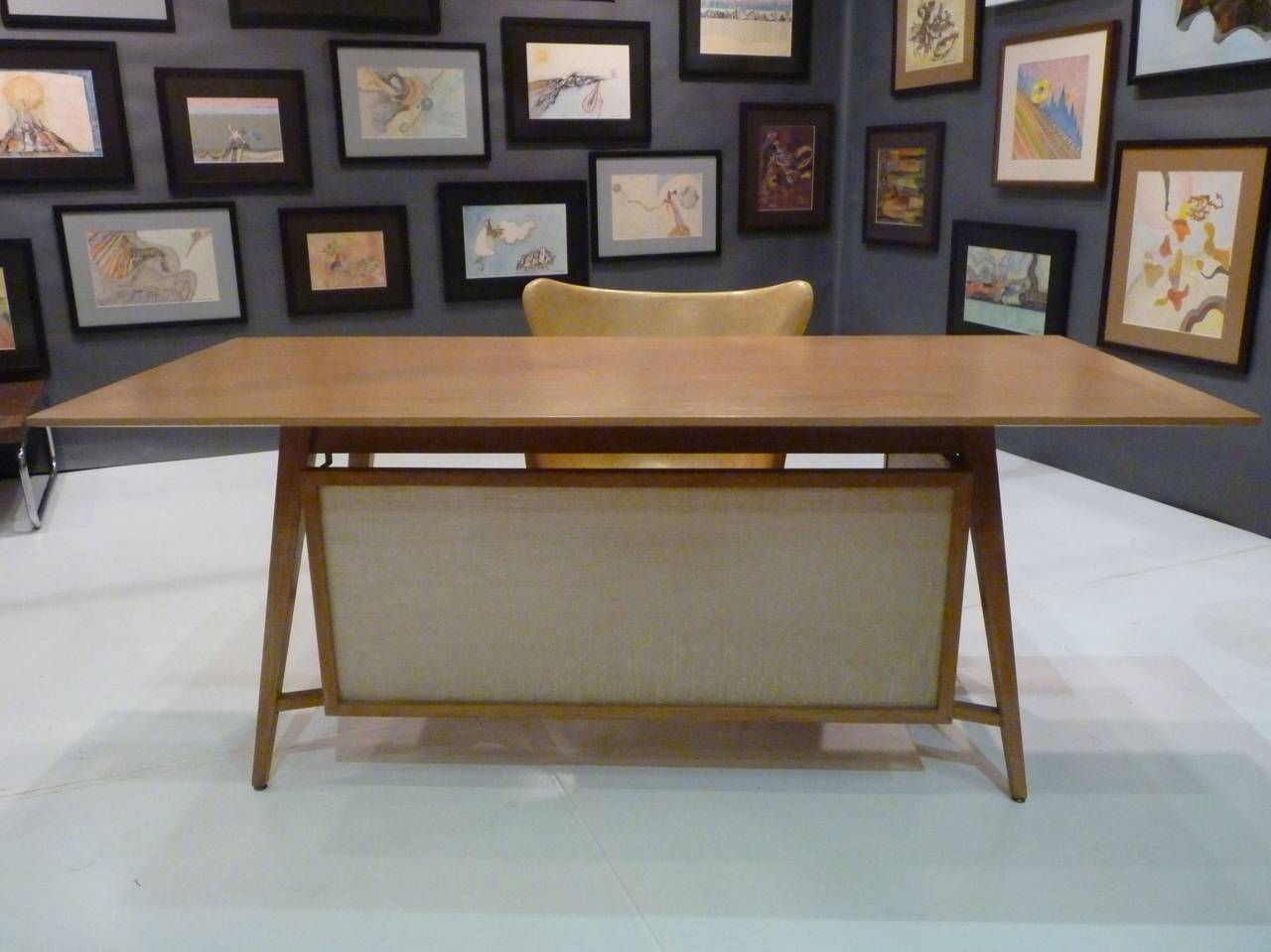 Custom California Modern desk, circa 1950s of bleached mahogany. Champagne finish and translucent screen make this a light and airy addition to any room. X-base is a great design touch and seldom seen in a desk. Asymmetrical privacy screen is on