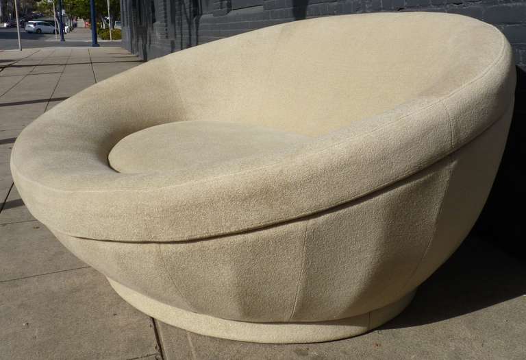 Large Oval Chaise Lounge Chair in the style of Milo Baughman in a nubby chenille. This looks to be a more recent production perhaps from the 90's, however it is very heavy and of the highest quality construction and craftsmanship. Seams are