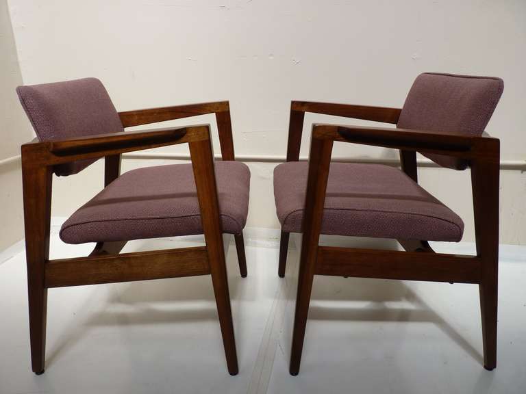 Total of 20 solid walnut chairs made by Gunlocke in original upholstery as shown. Walnut frames have been refinished in a clear satin lacquer as shown. Sold by the pair. These chairs are great for a restaurant or office setting as well as at home in