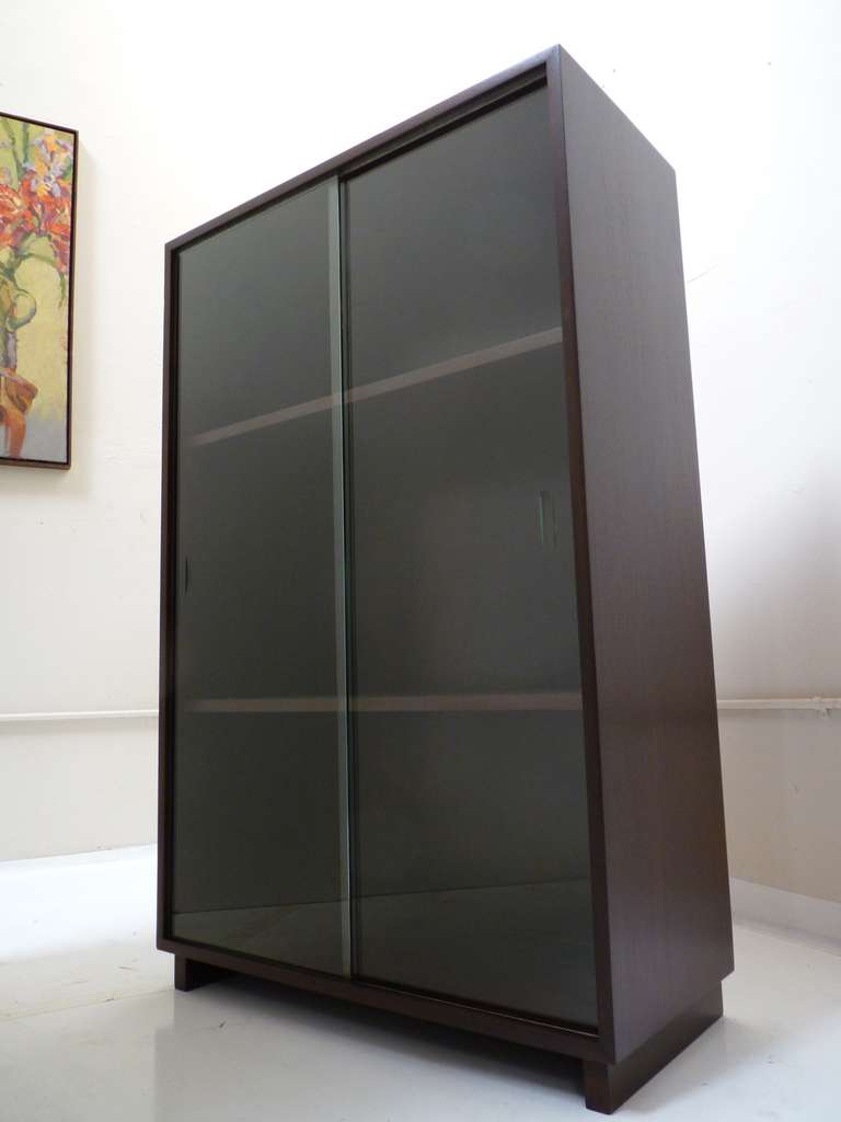 Glass front vitrine or display hutch by Edward Wormley for Dunbar. Piece is signed with 