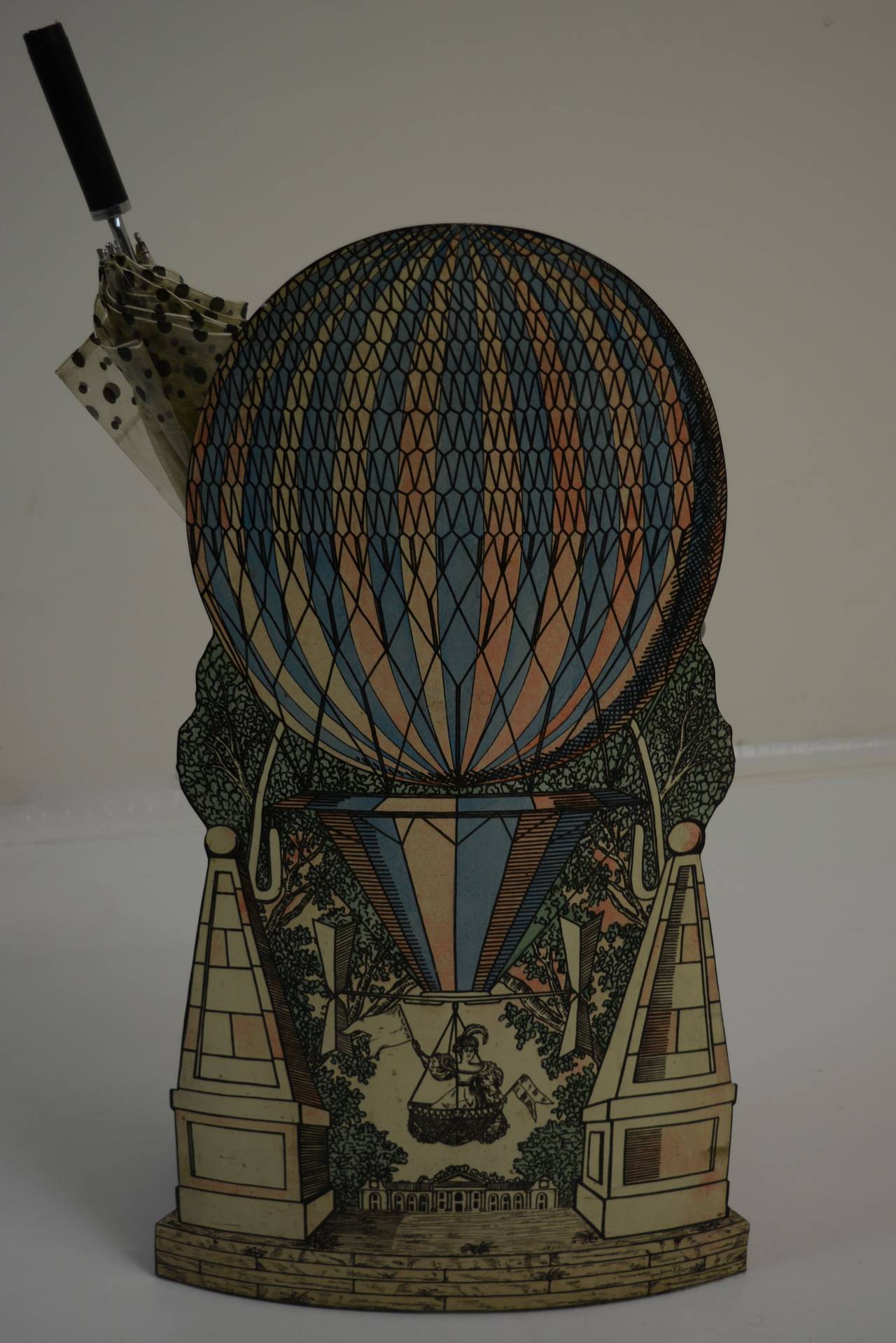 Umbrella Stand by Piero Fornasetti with hand-colored, lithographic transfer-printed steel and enameled steel frame. Nice patina consistent with age.