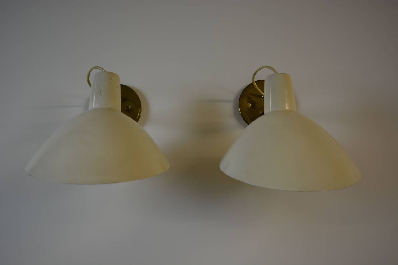 Pair of sconces with fully adjustable double swivel sockets at shades. Can also be mounted to be used as uplights. Designed by Vittoriano Viganò in Milano, Italy, circa 1950s. Each piece is signed as shown.