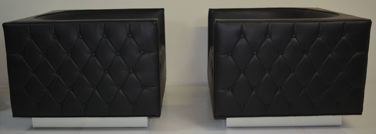 Tufted cube chairs by Brandon Vega, 2015. This pair is fitted with top-grain leather in black and a chrome plinth base-- available in swivel base as well. Can be made in COM at a discount. Please inquire about multiple pairs- lead time 2 to 3 weeks.