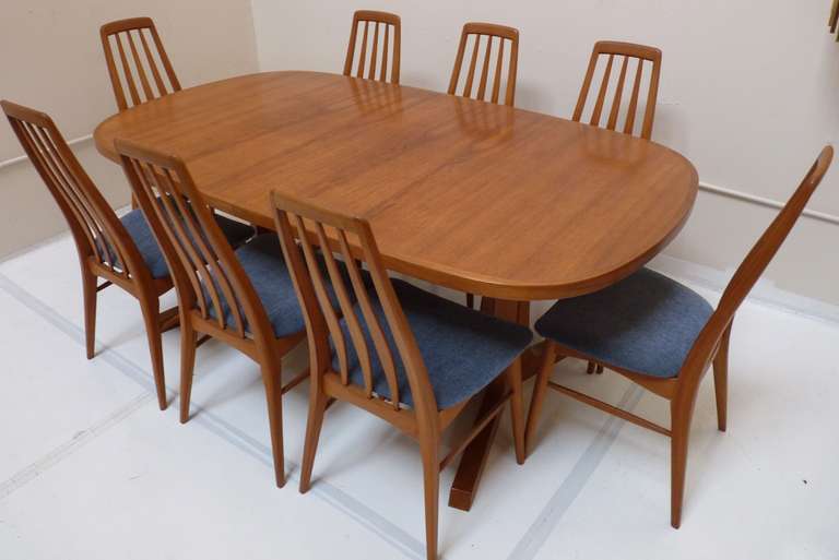 Danish Modern Dining Set with eight Eva Chairs in Teak. Table has two additional leaves not pictured at 19.25