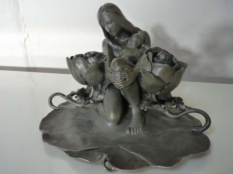 Bronze Inkwell by Charles Vital-Cornu, France c.1897 depicts mother and child in a garden with what appears to be two peonies with removable tops to reveal glass receptacles for ink.