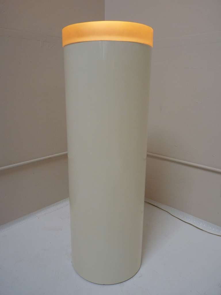 Lacquered Fiberglass Cylinder Pedestal with solid hued lucite top is perfect for display of sculptures. Light is softly diffused to give sculptures a glow, particularly glass.