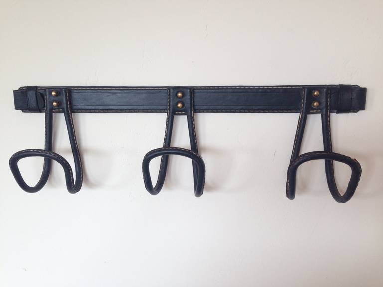 1950's Coat Rack by Jacques Adnet with a beautiful patina.