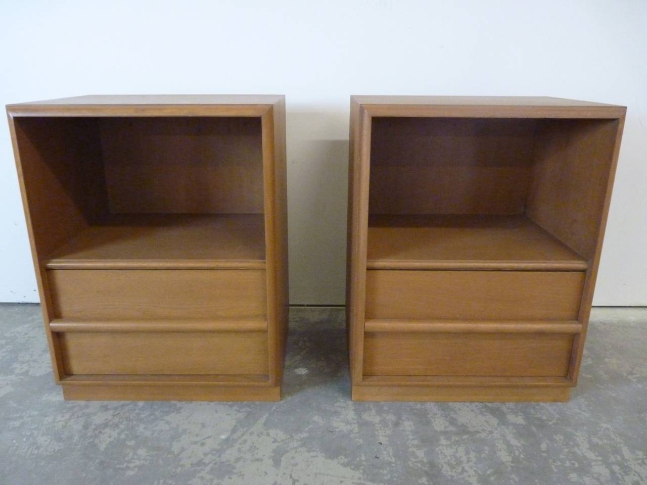 Pair of bleached walnut nightsands by Robsjohn-Gibbings for Widdicomb, circa 1953. Pair is in original finish and present very well. Can be refinished in the hue of your choice for a small fee.
Please also see our other listings for matching