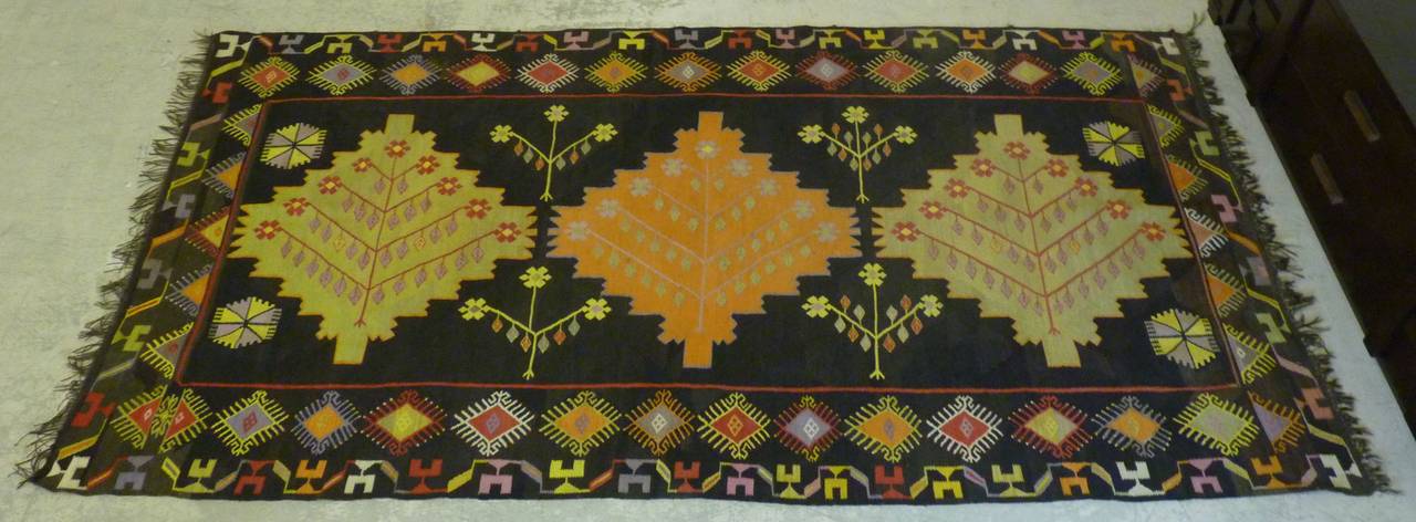 Dating to early 20th century, this Bessarabian Kilim has great colors and a tribal motif, rarely seen from the region. This rug has spent its life hung on a wall and as such is in very nice condition for age.