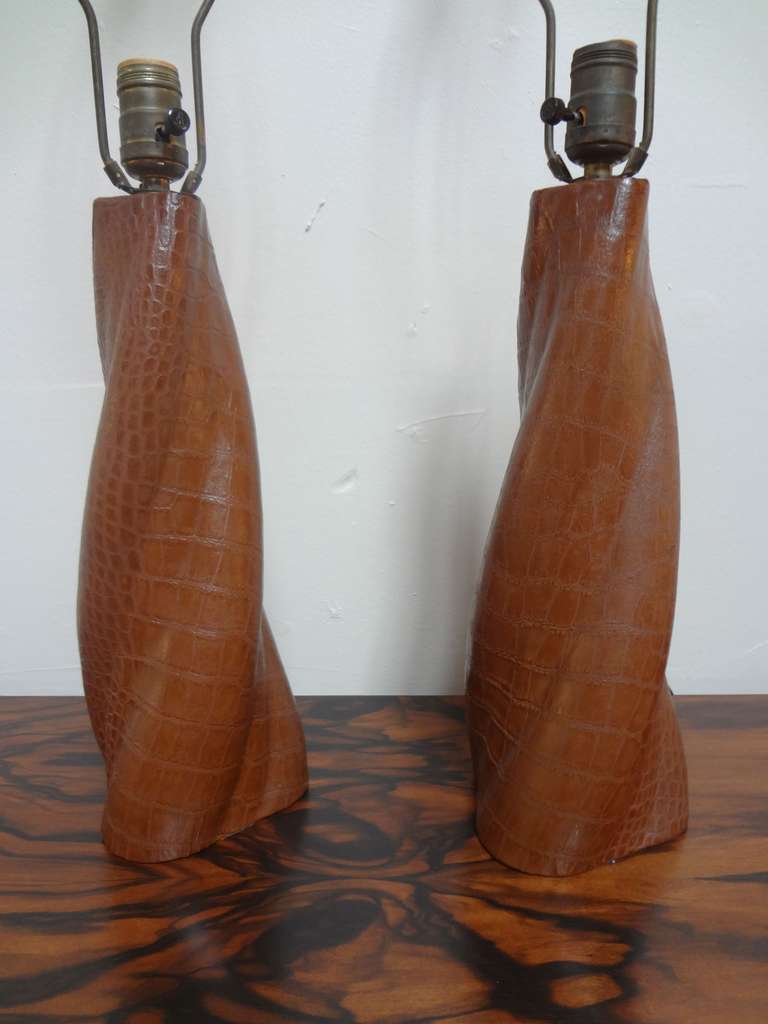 Pair of crocodile embossed leather lamps after Paul Dupre-Lafon in green with original matching finials. New shades included.