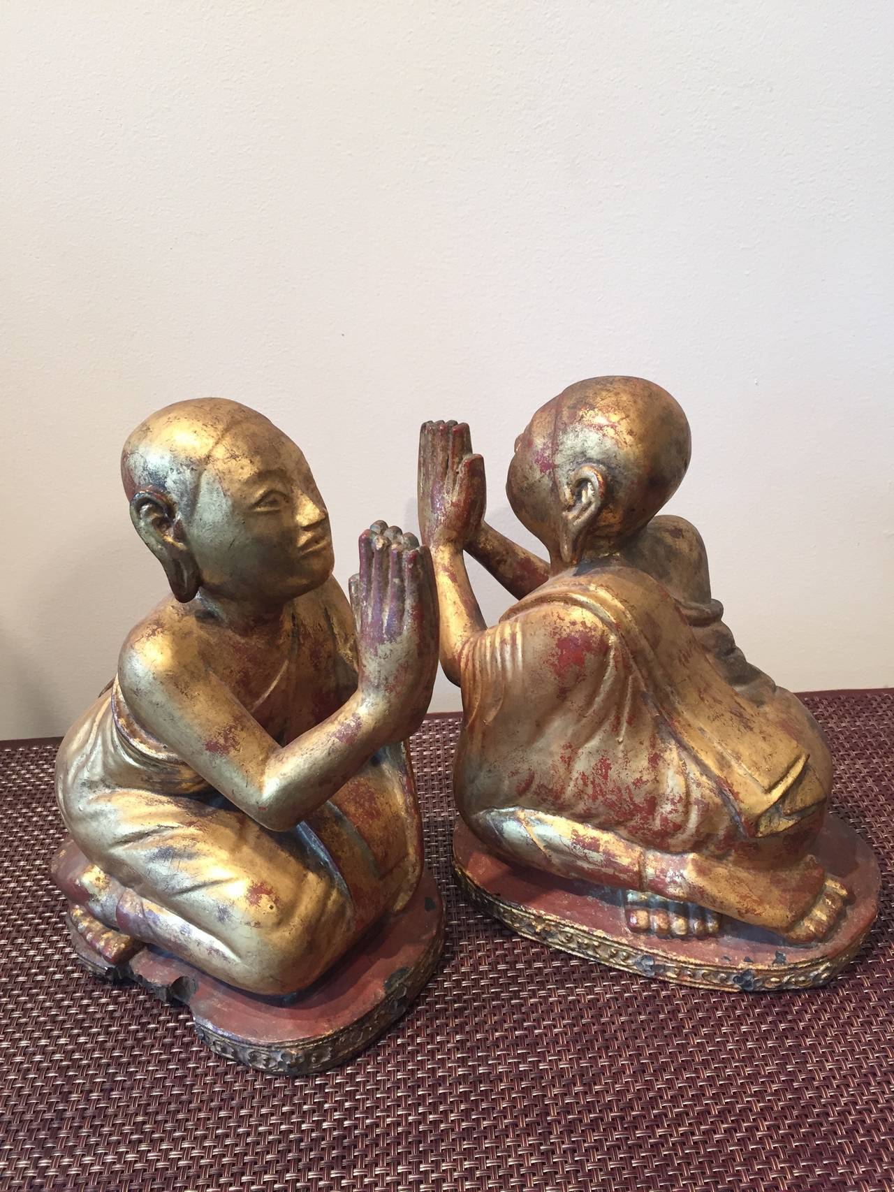 A vintage pair of nicely carved Burmese praying monks in gold and red lacquer with beautiful patina, Burma, circa 1940.
BH2007.