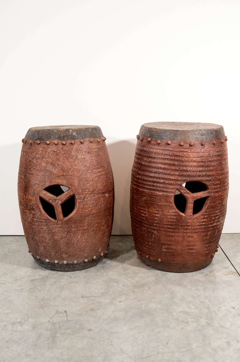 Red and black Chinese clay garden stools, circa 1900, from Xian, China.  Easily used as stools, side tables and pedestals. Several pieces available. Sizes, color and shapes will vary slightly due to their handmade nature.
Priced individually.
S526