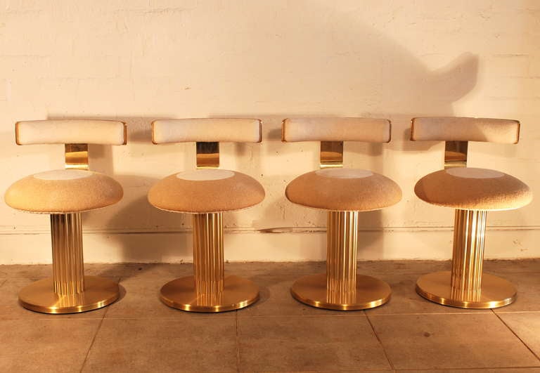 These four brass plated barstools based on our research were most likely specified by the designer Stephen Chase in the 1970s.  The seat height is 19