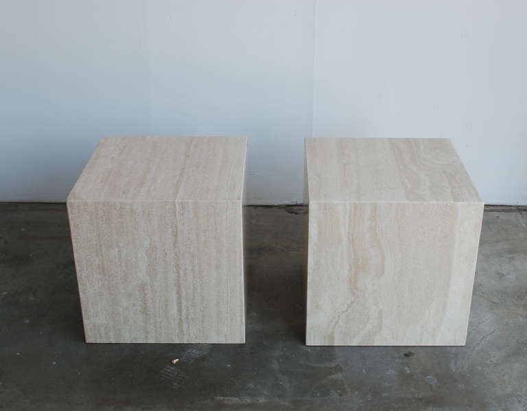 This is a nice modernist pair of filled travertine side tables.  We have had them professionally  polished and sealed to restore them to their original matt finish luster.