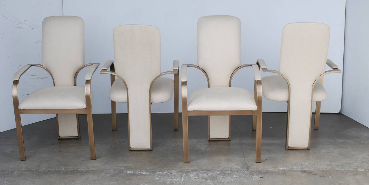 Freshly plated in a rich burnished brass these are a stunning set of 1970s era dining chairs. The shape is reminiscent of some of Pierre Cardin's chairs. They sit very comfortably with the high back and the curved arms.
They are an excellent