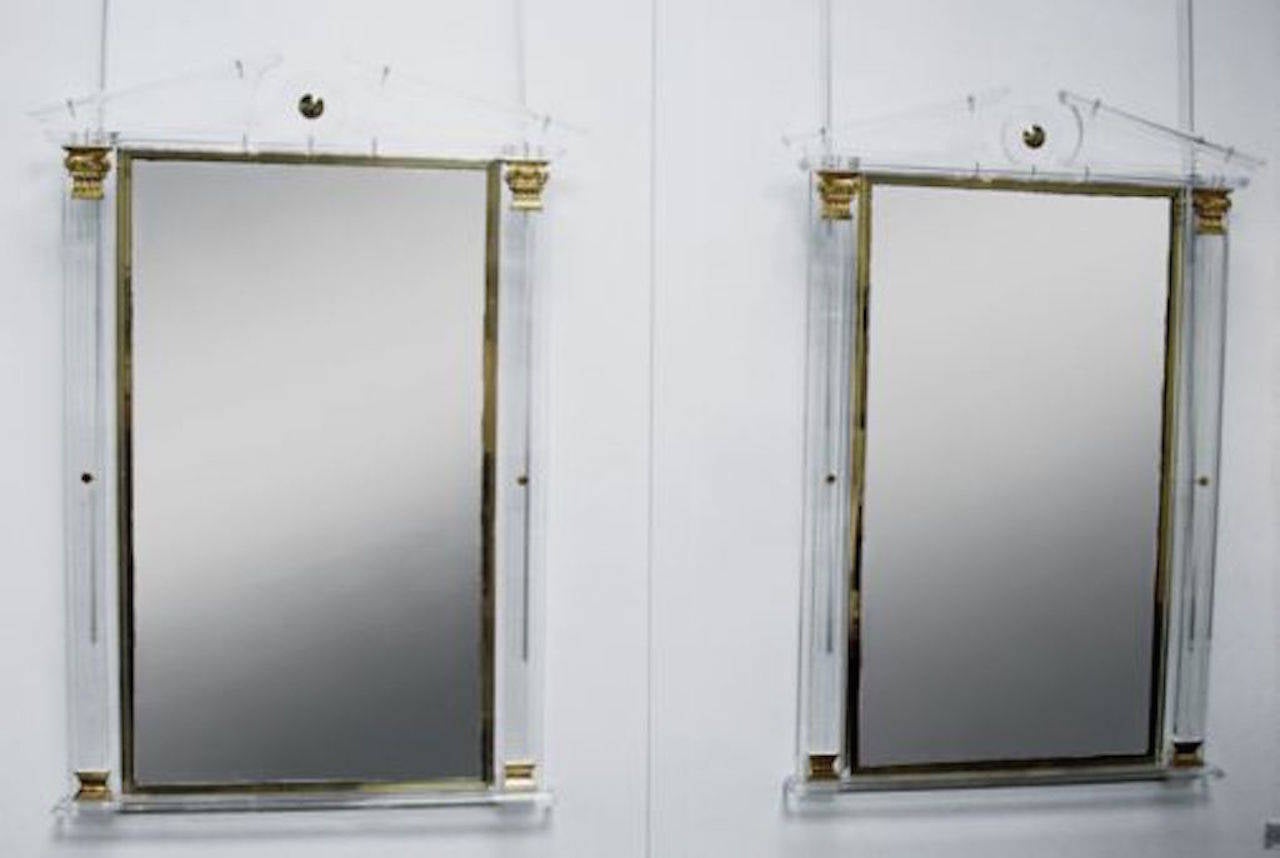 Superb pair of Lucite and gilt mirrors.

Superb pair of Lucite and gilt mirrors, circa 1970. Possibly Italian or American.