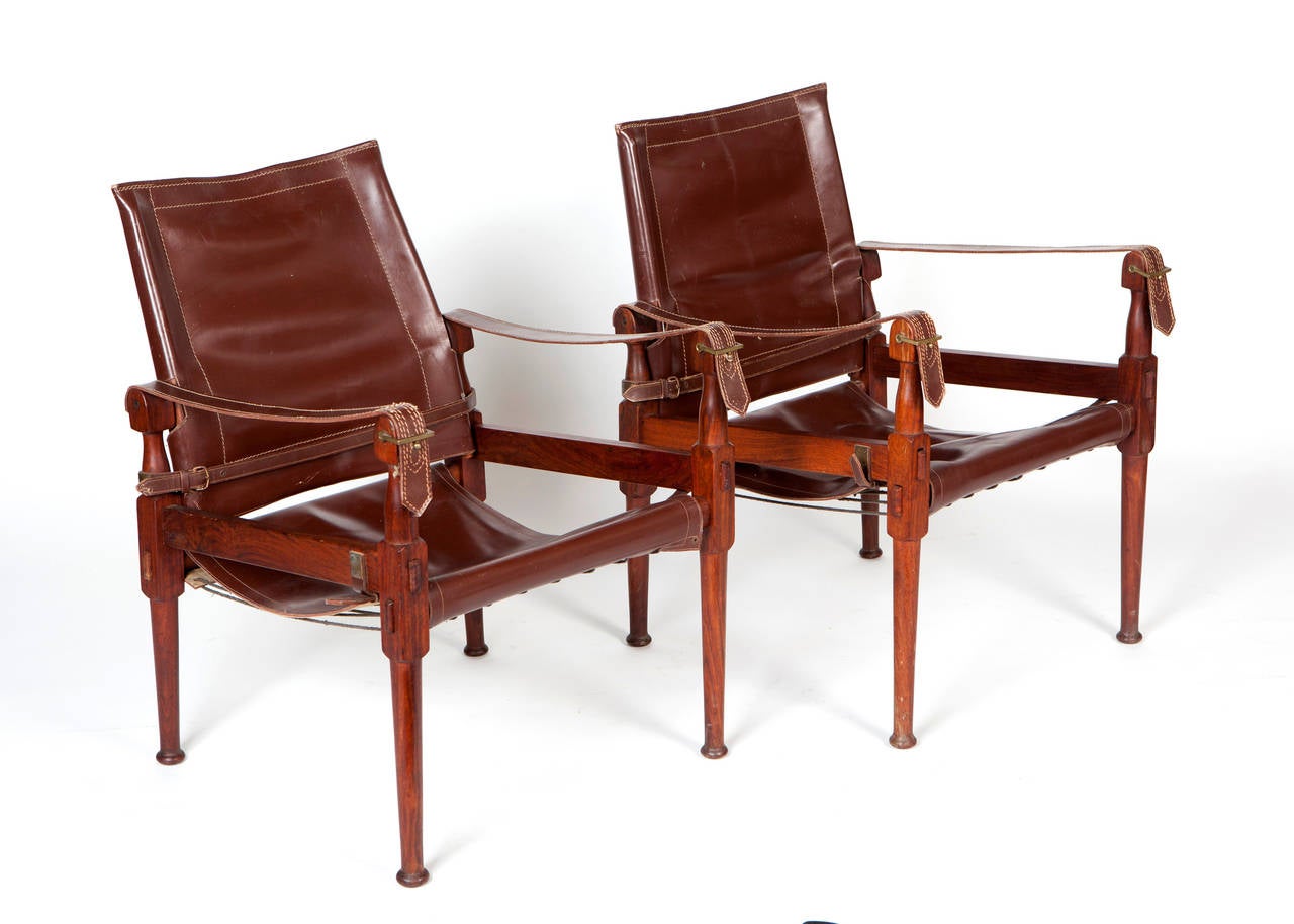 Pair of teak and leather safari chairs by Kaare Klint.