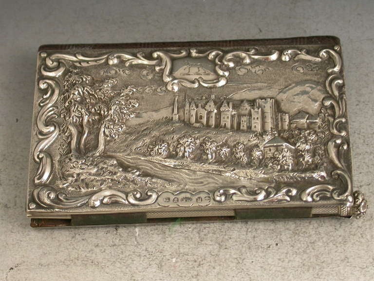 An extremely rare William IV silver mounted Aide Memoire with two rectangular silver panels chased and embossed with landscape scenes inside scroll-work borders, one depicting a rare view of Abbotsford House (the home of Sir Walter Scott) from